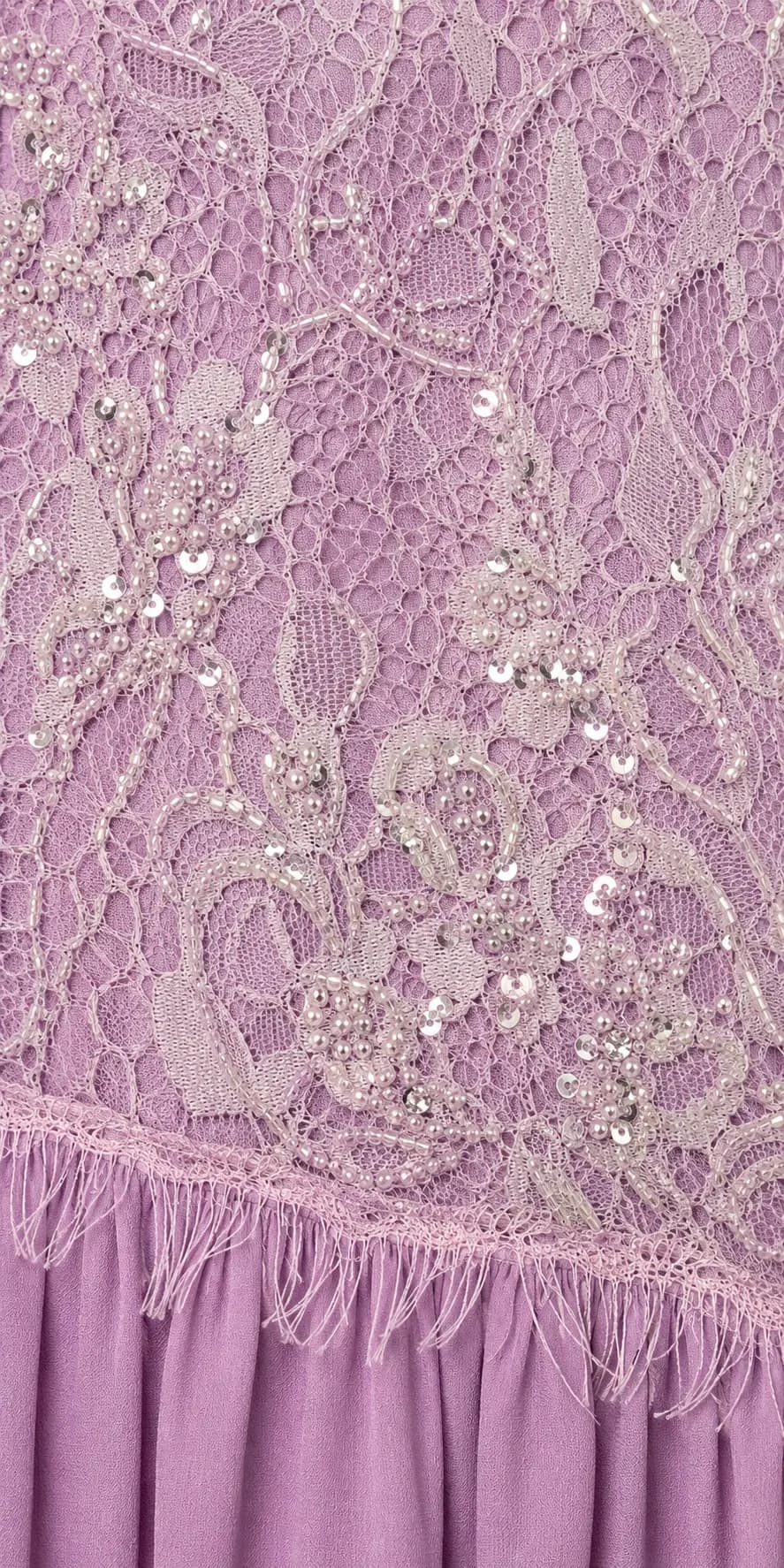 Close-up of beaded lilac lace on a Joie Couture gown